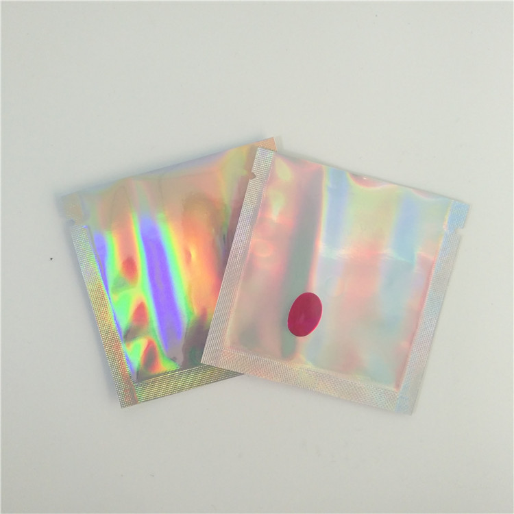 密封されたポリ袋を包む虹は小型透明なレーザー光線写真宝石類の袋をヒート シールしました