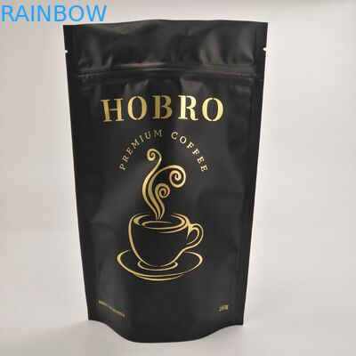 マットの弁が付いている黒い薄板にされたアルミ ホイルのジッパー ロックのコーヒー包装袋のコーヒー豆包装袋の上の立場
