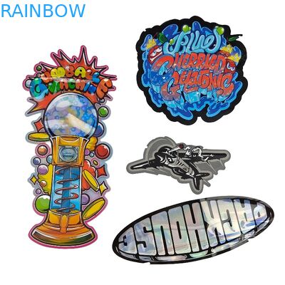 注文3.5g - 28g光沢があるホログラムによって型抜きされるマイラーは食糧力のクッキーのための特別な形を袋に入れる