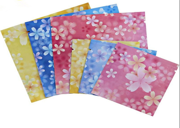 マスクのために包むカスタマイズされた3つの側面によって密封されるピンク色化粧品袋