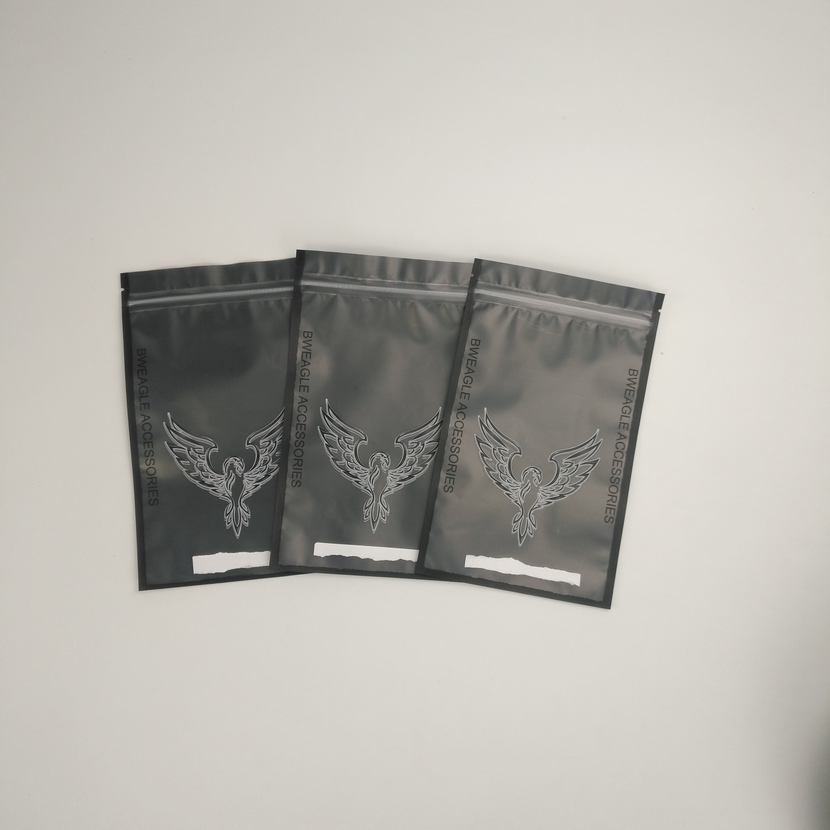 注文のロゴの袋を包む袋のイヤホーンのヘッドホーンのヘッドホーンを包むカスタマイズされた光沢のあるイヤホーンの付属品