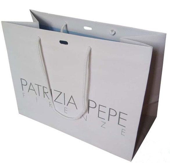 中心の穴が付いている大きく白いクラフト紙のカスタマイズされた紙袋